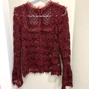 itāsāaābeautifulāburgundyĀ laceāblouse.